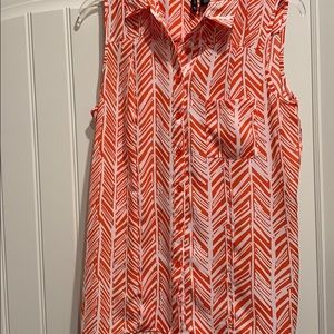 Barely worn, flattering, longer in back. No iron.